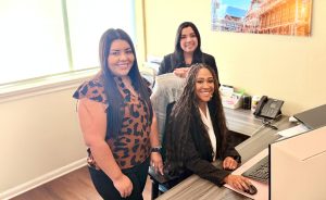 women front of house at cokebusters usa